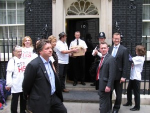 Joe gives box of petition sheets to Downing Street official