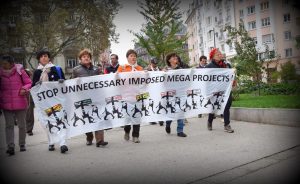 Shows banner against ‘unnecessary, imposed mega projects’